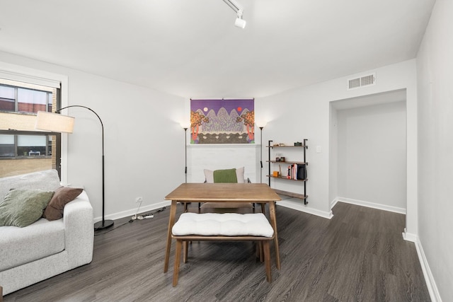 7409 N Seeley Ave Unit 2B, Chicago, IL 60645 - living room featuring dark wood-type flooring and baseboards