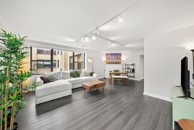 7409 N Seeley Ave Unit 2B, Chicago, IL 60645 - living room featuring rail lighting and dark wood-style flooring