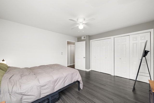 7409 N Seeley Ave Unit 2B, Chicago, IL 60645 - bedroom with two closets, dark wood-style flooring, and a ceiling fan