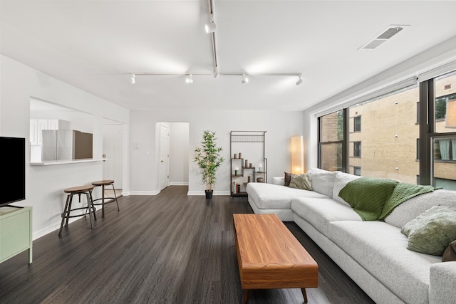 7409 N Seeley Ave Unit 2B, Chicago, IL 60645 - living area featuring rail lighting and dark wood finished floors