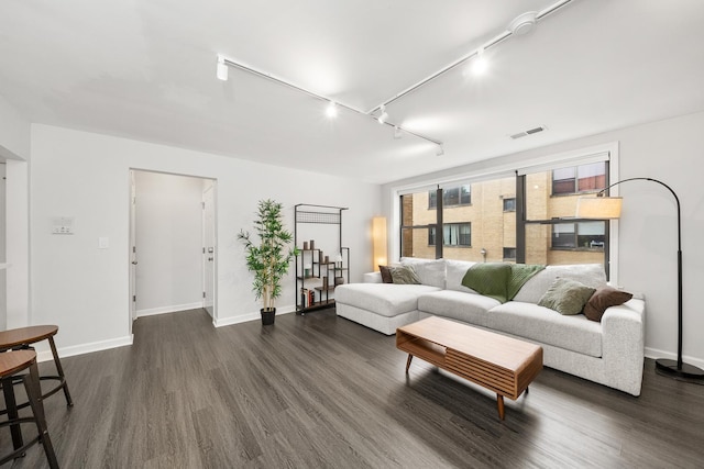 7409 N Seeley Ave Unit 2B, Chicago, IL 60645 - living area featuring dark wood finished floors and rail lighting