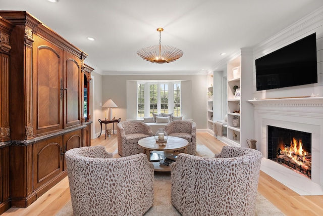 15606 W Sweedler Rd, Manhattan, IL 60442 - living area with light wood-style flooring, a fireplace with flush hearth, crown molding, recessed lighting, and built in shelves