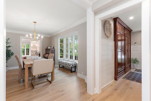 15606 W Sweedler Rd, Manhattan, IL 60442 - dining space featuring light wood-style flooring, a chandelier, and ornamental molding