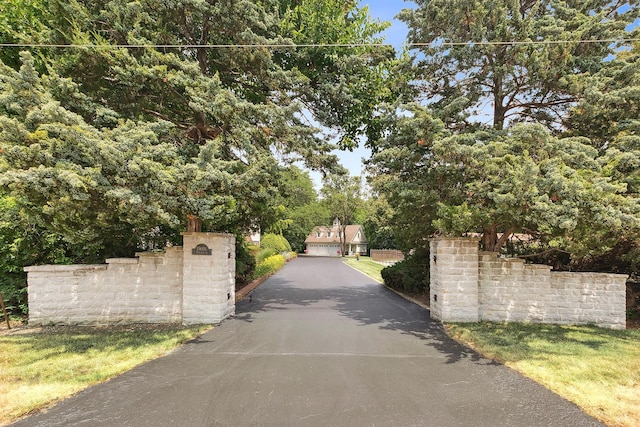 15606 W Sweedler Rd, Manhattan, IL 60442 - view of asphalt driveway with view of scattered trees