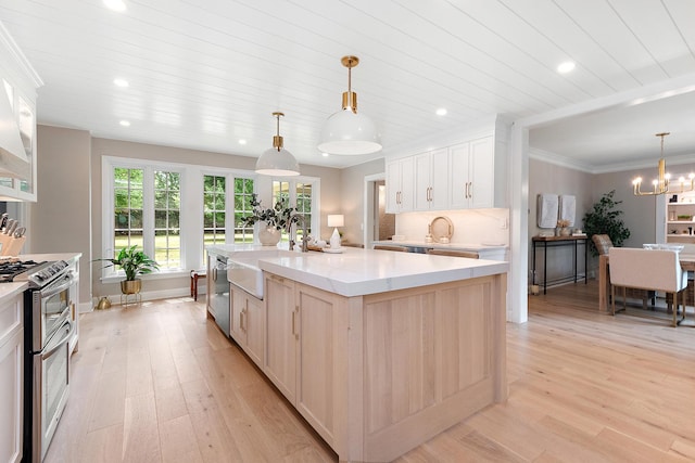 15606 W Sweedler Rd, Manhattan, IL 60442 - kitchen featuring appliances with stainless steel finishes, light wood-type flooring, recessed lighting, a large island, and white cabinets