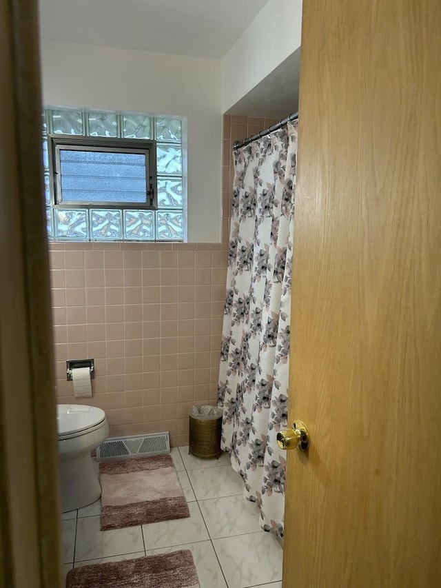 9362 Clancy Dr, Des Plaines, IL 60016 - full bathroom with tile walls and a shower with curtain