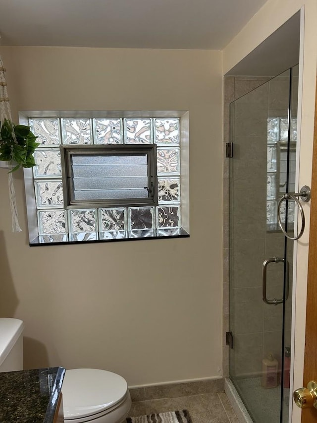 9362 Clancy Dr, Des Plaines, IL 60016 - bathroom with tile patterned flooring, a stall shower, and vanity