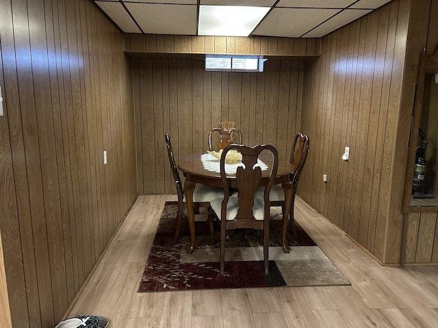 9362 Clancy Dr, Des Plaines, IL 60016 - dining area with wood walls, light wood-type flooring, and a drop ceiling