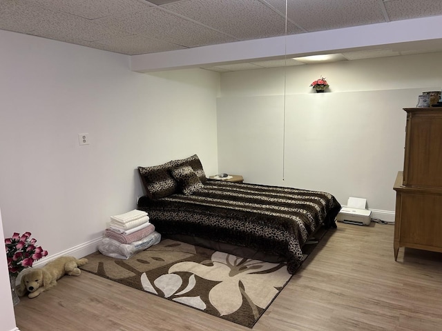 9362 Clancy Dr, Des Plaines, IL 60016 - bedroom with light wood-style floors and a drop ceiling