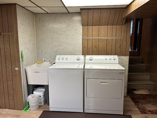 9362 Clancy Dr, Des Plaines, IL 60016 - washroom with separate washer and dryer and wood finished floors