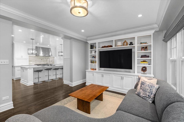 330 Abbotsford Rd, Kenilworth, IL 60043 - living area with dark wood finished floors, crown molding, and recessed lighting