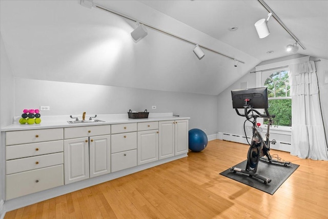 330 Abbotsford Rd, Kenilworth, IL 60043 - exercise area with rail lighting, vaulted ceiling, light wood-style floors, and a baseboard radiator