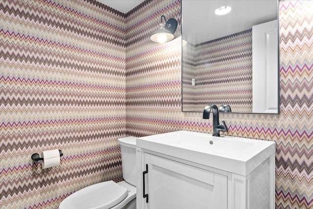 330 Abbotsford Rd, Kenilworth, IL 60043 - half bath featuring wallpapered walls and vanity