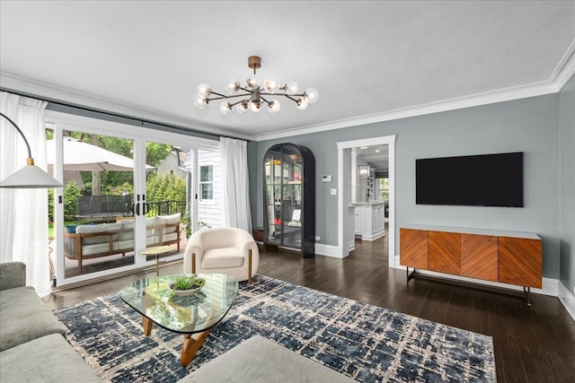 330 Abbotsford Rd, Kenilworth, IL 60043 - living area featuring ornamental molding, a chandelier, wood finished floors, and arched walkways