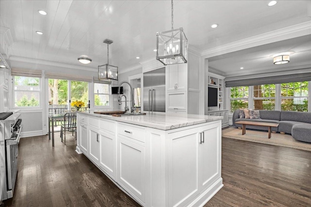 330 Abbotsford Rd, Kenilworth, IL 60043 - kitchen with a chandelier, high end stove, dark wood finished floors, white cabinetry, and ornamental molding