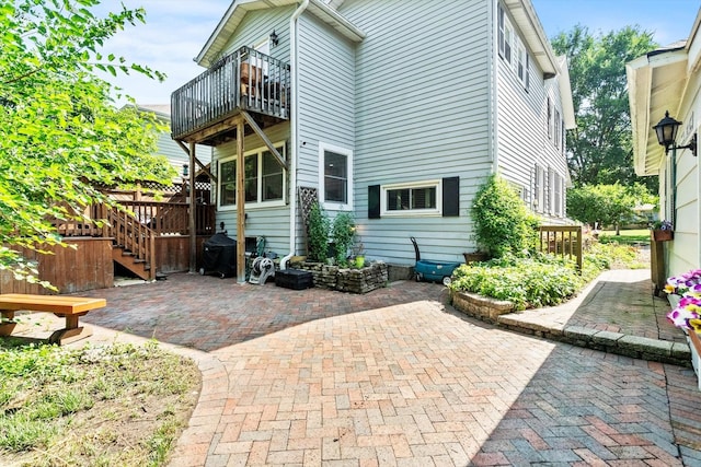 338 N Benton St, Palatine, IL 60067 - rear view of house featuring a balcony and a patio area