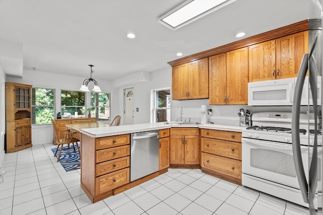 338 N Benton St, Palatine, IL 60067 - kitchen featuring white appliances, a peninsula, light countertops, recessed lighting, and brown cabinetry