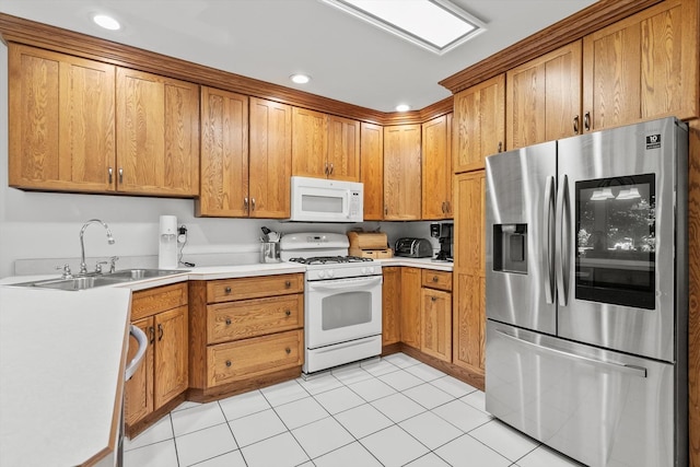 338 N Benton St, Palatine, IL 60067 - kitchen with white appliances, brown cabinetry, light countertops, light tile patterned flooring, and recessed lighting