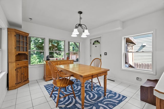 338 N Benton St, Palatine, IL 60067 - dining space with light tile patterned floors and a chandelier