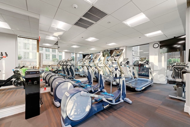 21 E Huron St Unit 3704, Chicago, IL 60611 - gym with carpet, a paneled ceiling, and a wall of windows