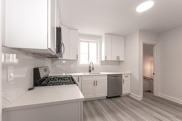 10940 S Trumbull Ave, Chicago, IL 60655 - kitchen with stainless steel appliances, light wood-type flooring, backsplash, and white cabinets