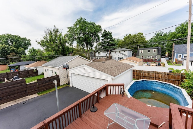 10940 S Trumbull Ave, Chicago, IL 60655 - wooden deck featuring a hot tub, a fenced backyard, an outdoor structure, and a residential view