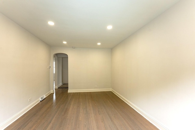 10940 S Trumbull Ave, Chicago, IL 60655 - spare room with arched walkways, recessed lighting, and dark wood finished floors