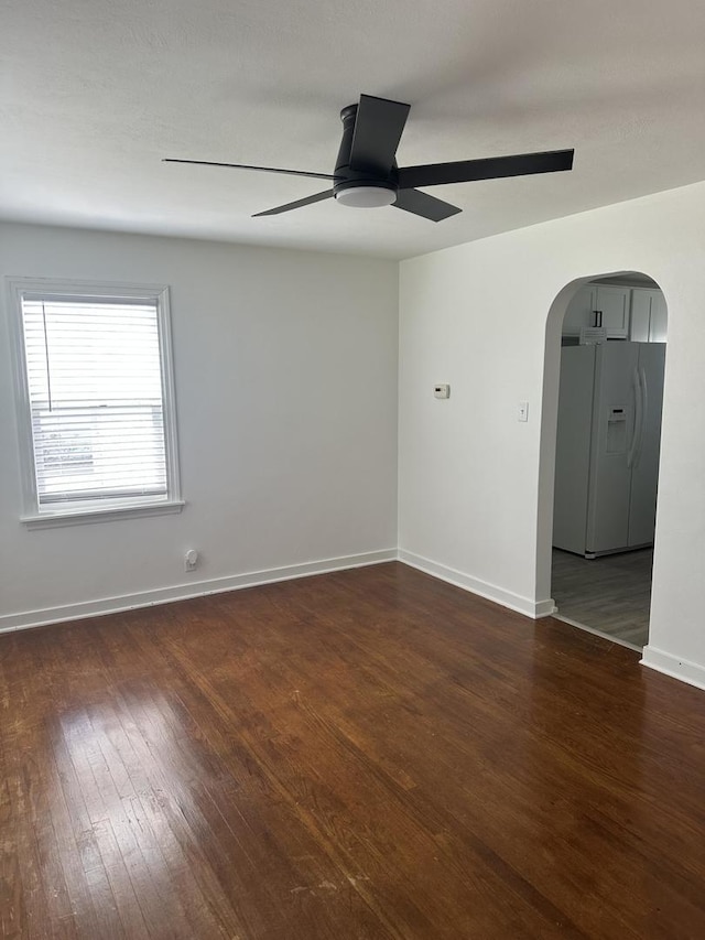 925 E Sangamon Ave, Rantoul, IL 61866 - spare room with a ceiling fan, wood finished floors, and arched walkways