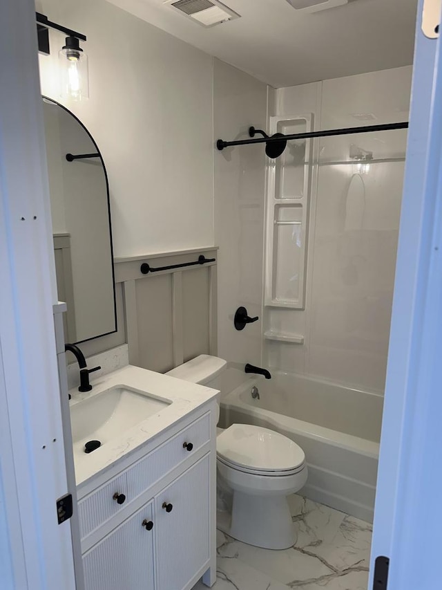 925 E Sangamon Ave, Rantoul, IL 61866 - full bathroom featuring vanity, marble look tiles, and shower / tub combination