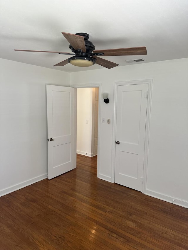 925 E Sangamon Ave, Rantoul, IL 61866 - unfurnished bedroom with wood finished floors and a ceiling fan
