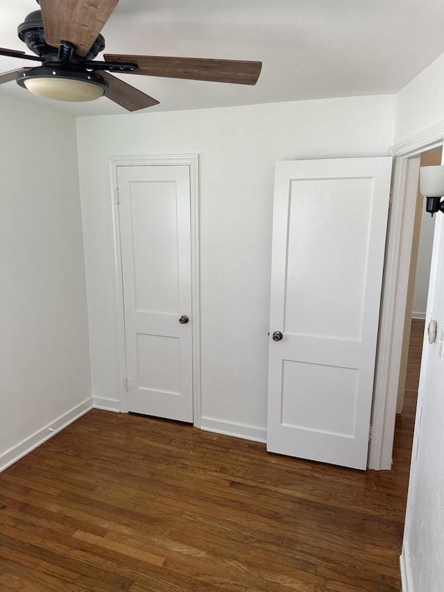 925 E Sangamon Ave, Rantoul, IL 61866 - unfurnished bedroom with wood finished floors and ceiling fan