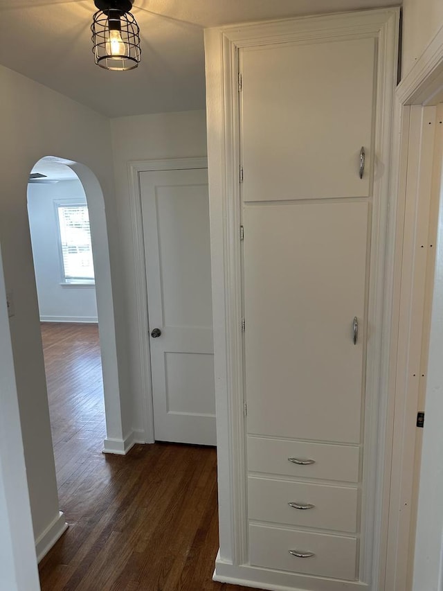 925 E Sangamon Ave, Rantoul, IL 61866 - corridor with arched walkways and dark wood-style floors