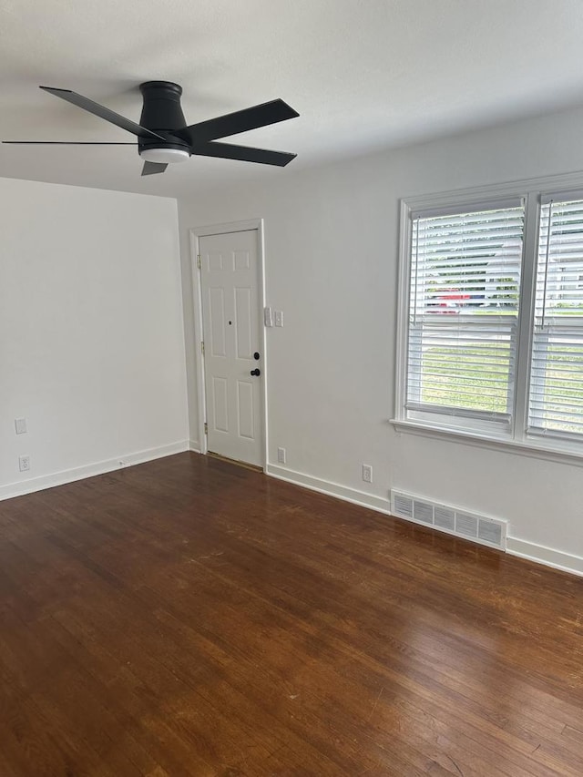 925 E Sangamon Ave, Rantoul, IL 61866 - unfurnished room with ceiling fan, healthy amount of natural light, and wood finished floors