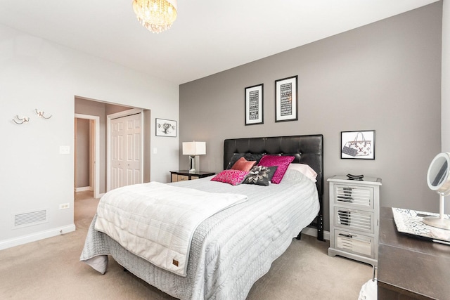 140 S River St Unit 307, Aurora, IL 60506 - bedroom with carpet flooring, a closet, and a chandelier