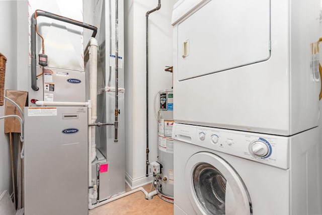 140 S River St Unit 307, Aurora, IL 60506 - laundry area featuring estacked washer and dryer, heating unit, and gas water heater