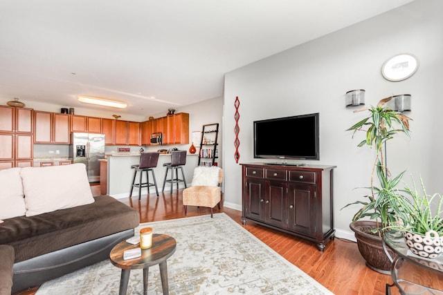 140 S River St Unit 307, Aurora, IL 60506 - living area featuring wood finished floors and baseboards