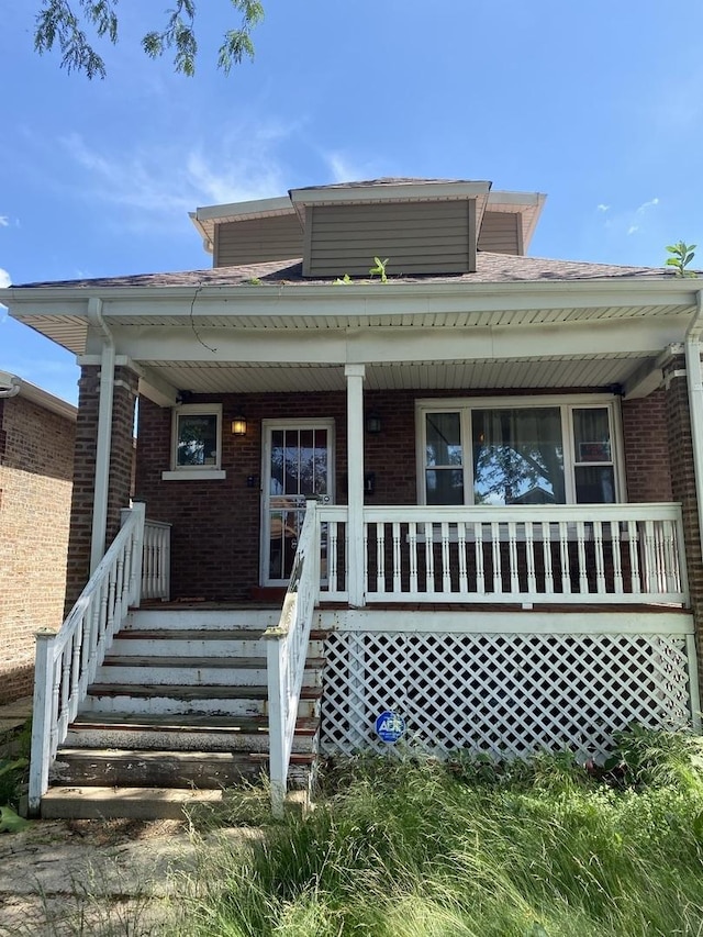 8611 S Aberdeen St, Chicago, IL 60620 - bungalow-style house with brick siding and a porch