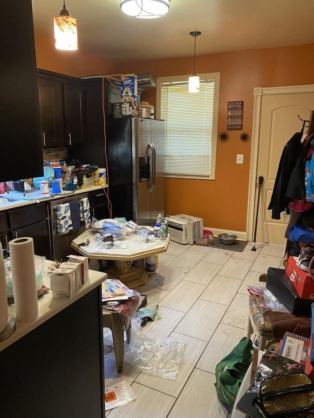 8611 S Aberdeen St, Chicago, IL 60620 - kitchen with wood tiled floors, decorative light fixtures, stainless steel refrigerator with ice dispenser, and light countertops