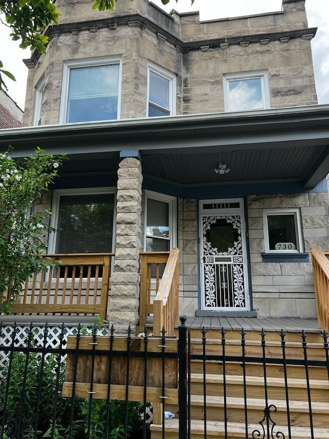 730 N Spaulding Ave, Chicago, IL 60624 - doorway to property with covered porch and stone siding
