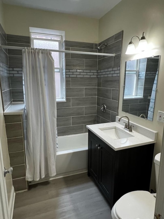 730 N Spaulding Ave, Chicago, IL 60624 - full bath with shower / bath combo with shower curtain, vanity, and wood finished floors