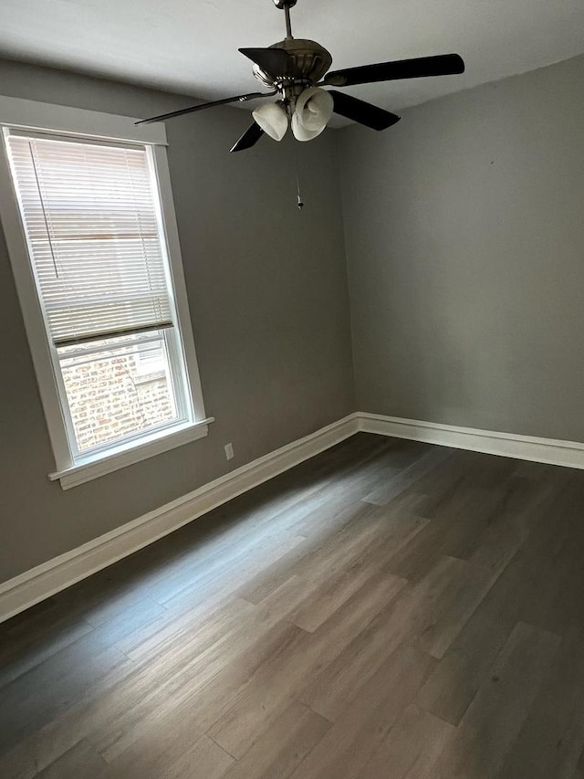 730 N Spaulding Ave, Chicago, IL 60624 - spare room featuring dark wood-style floors and ceiling fan