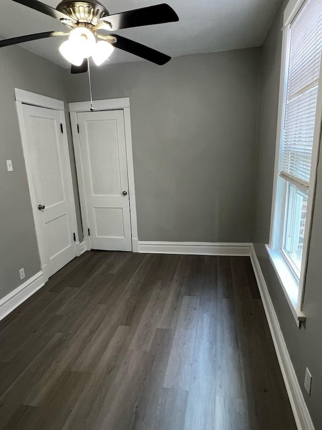 730 N Spaulding Ave, Chicago, IL 60624 - unfurnished bedroom featuring dark wood finished floors and a ceiling fan
