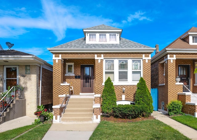 4751 S Hamlin Ave, Chicago, IL 60632 - bungalow-style home with brick siding and roof with shingles