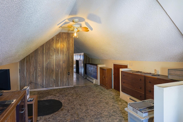 4751 S Hamlin Ave, Chicago, IL 60632 - bonus room featuring ceiling fan, a textured ceiling, vaulted ceiling, a baseboard heating unit, and wood walls