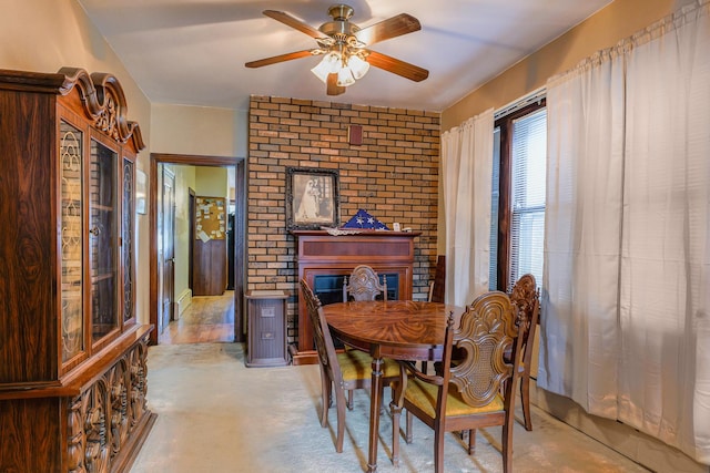4751 S Hamlin Ave, Chicago, IL 60632 - dining room featuring a ceiling fan, a fireplace, and brick wall