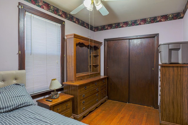 4751 S Hamlin Ave, Chicago, IL 60632 - bedroom with wood finished floors, a closet, and a ceiling fan