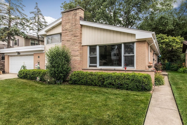 1231 N Hamlin Ave, Park Ridge, IL 60068 - view of front facade featuring a chimney, a garage, brick siding, and driveway