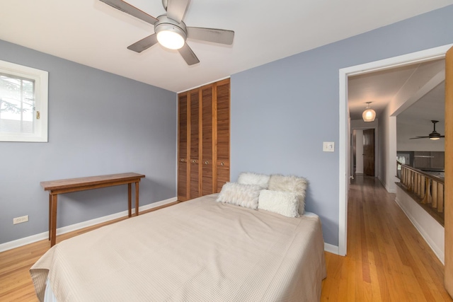 1231 N Hamlin Ave, Park Ridge, IL 60068 - bedroom with a closet, light wood-style flooring, and ceiling fan