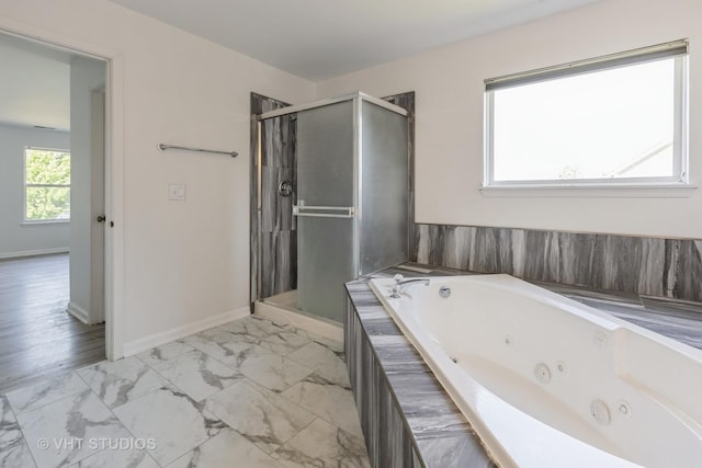 2895 Lahinch Ct, Aurora, IL 60503 - full bath with marble look tiles, a shower stall, and a tub with jets