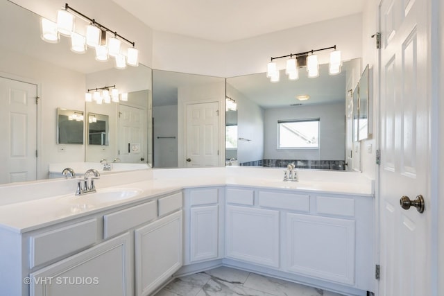 2895 Lahinch Ct, Aurora, IL 60503 - bathroom featuring double vanity and marble look tiles